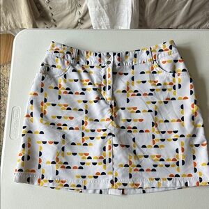 Slazenger White Skort with Yellow, Orange & Black Geo Print 4